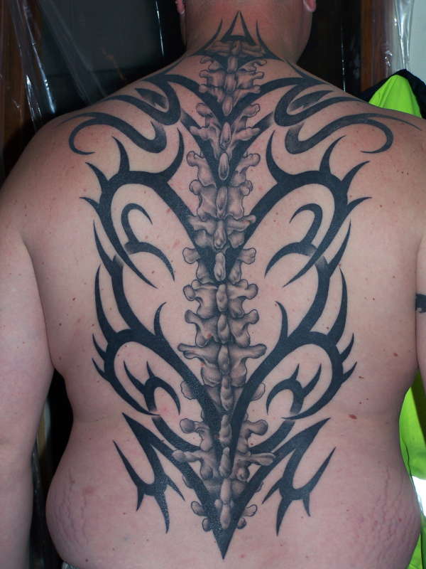 Tribal spine tattoo.