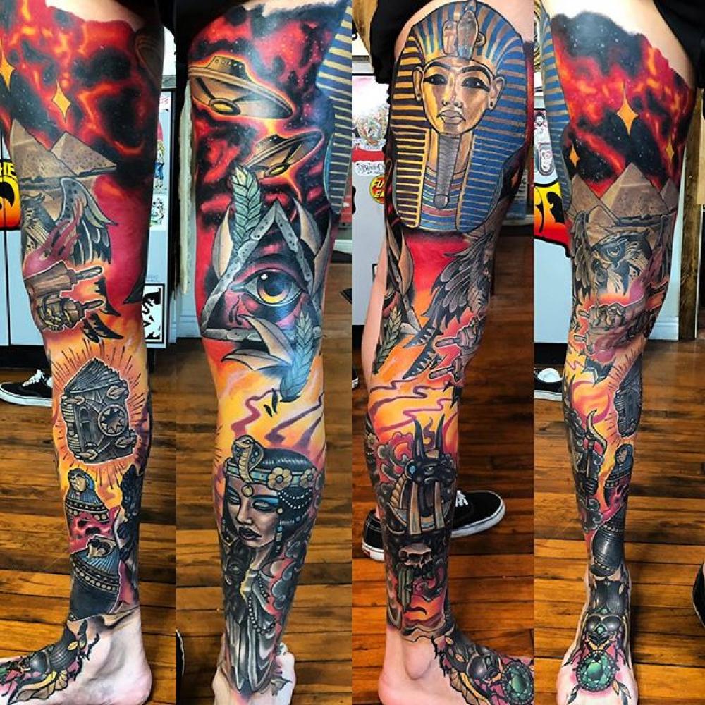 Abstract Leg and sleeve tattoo.