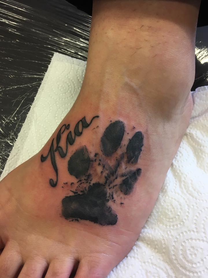Tiger paw print tattoos.