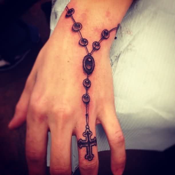 Nice rosary tattoo on wrist. 